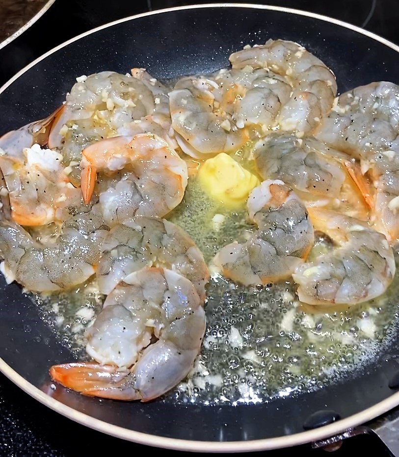 add butter to the cooking shrimp