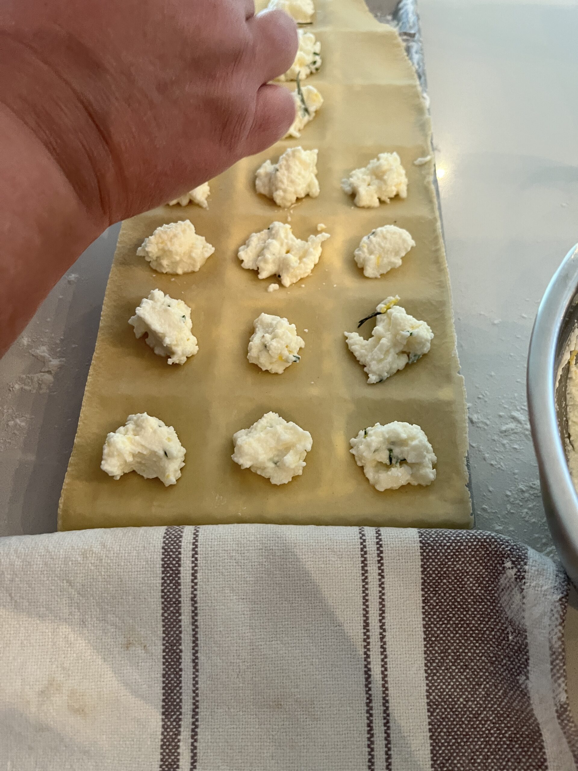 spoon ricotta filling into indentations