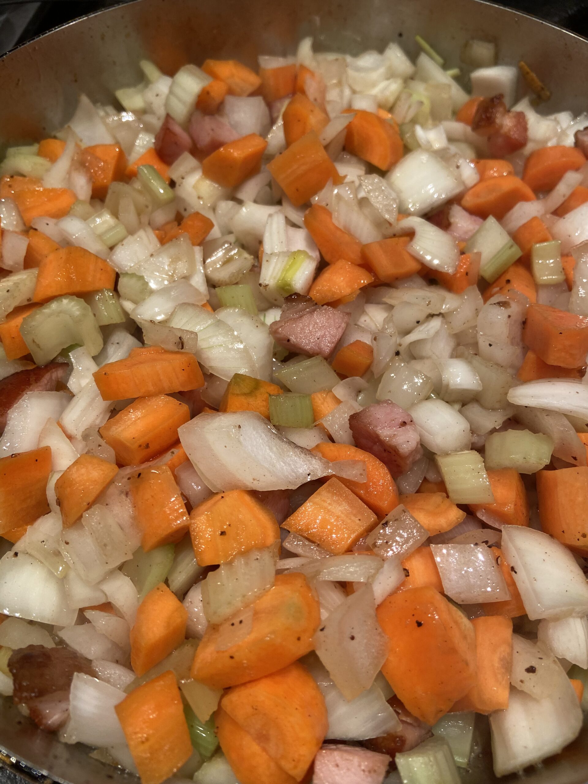 Fry bacon followed by onions, celery and carrots