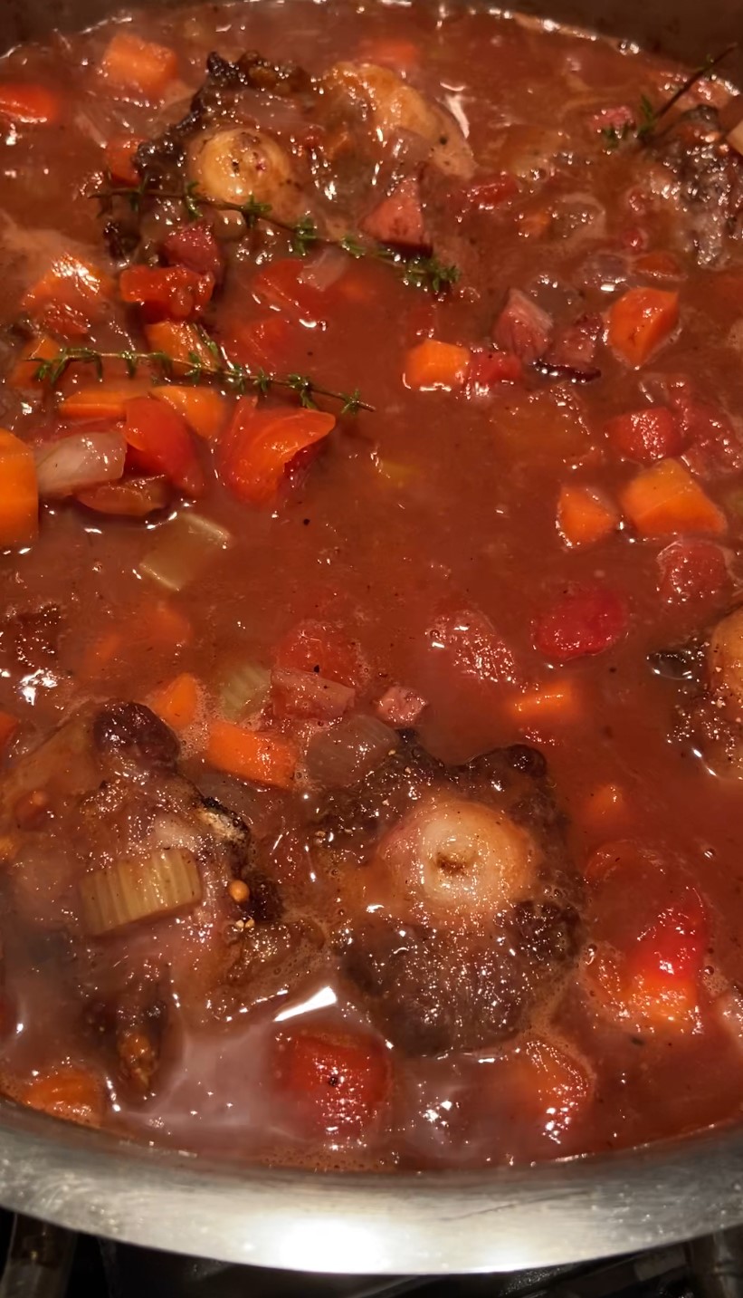 return seared oxtails to a Dutch oven and add liquids