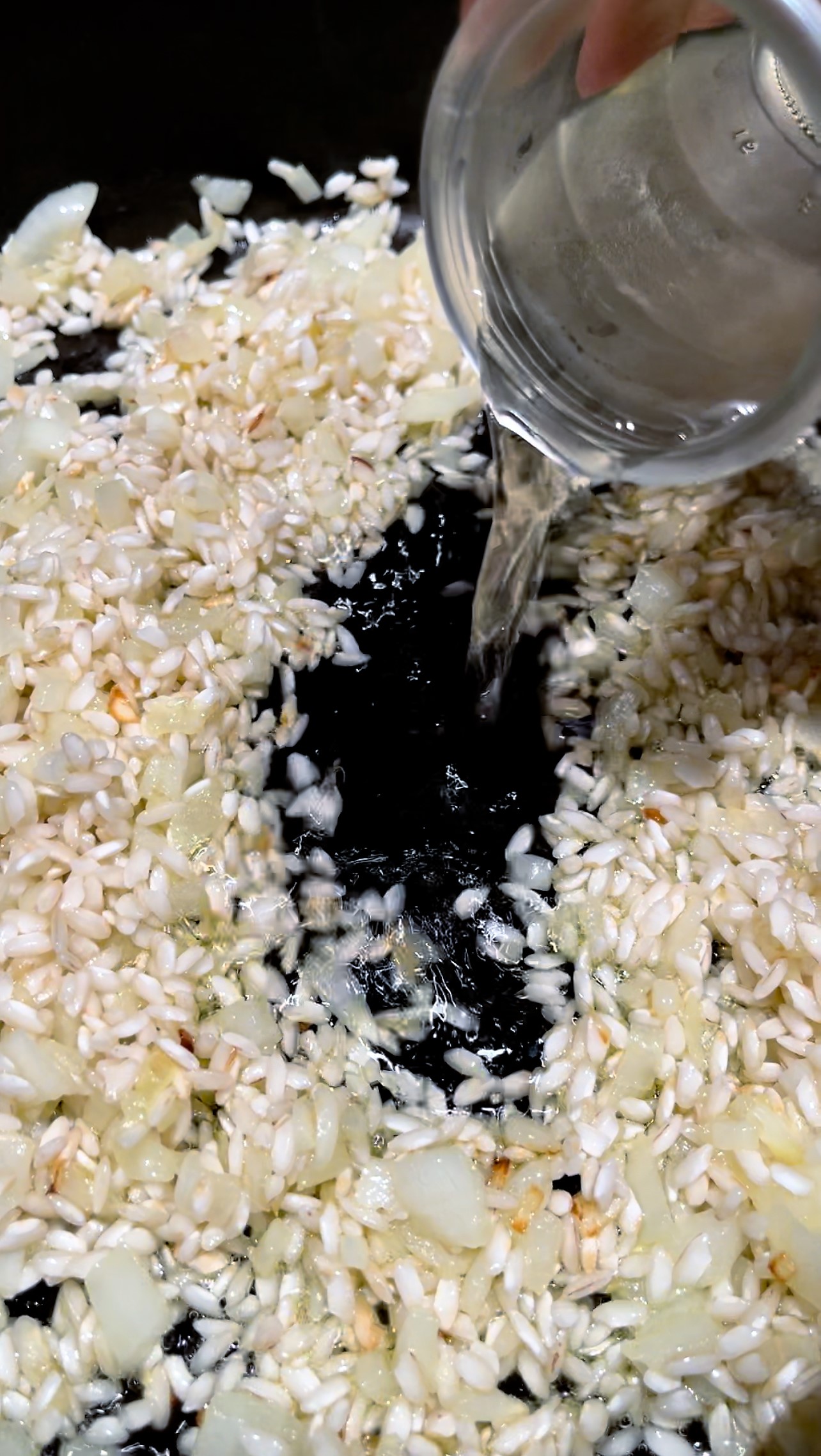 toast risotto rice then add cooking liquid