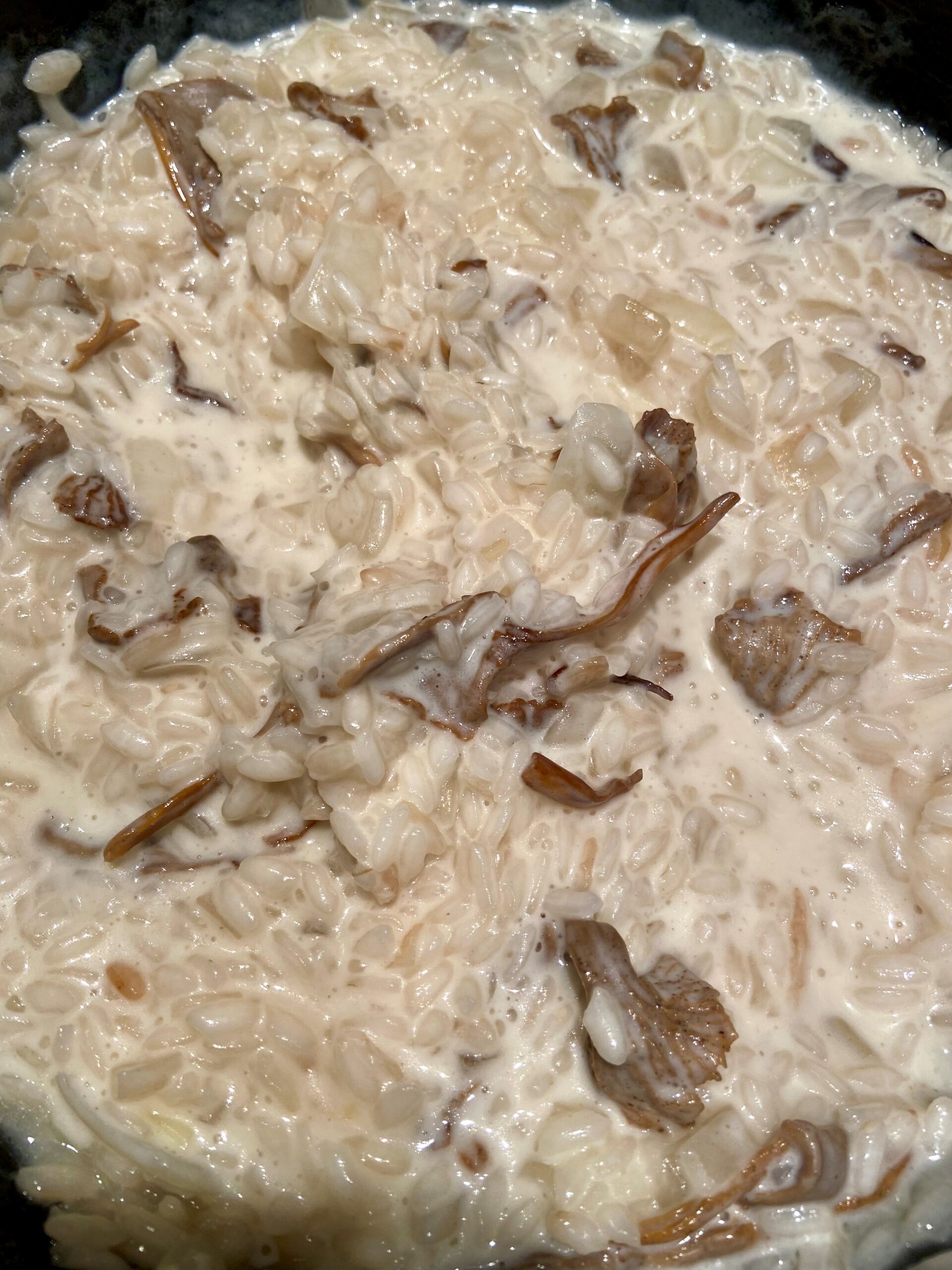 emulsify risotto with cheese and whipping cream 