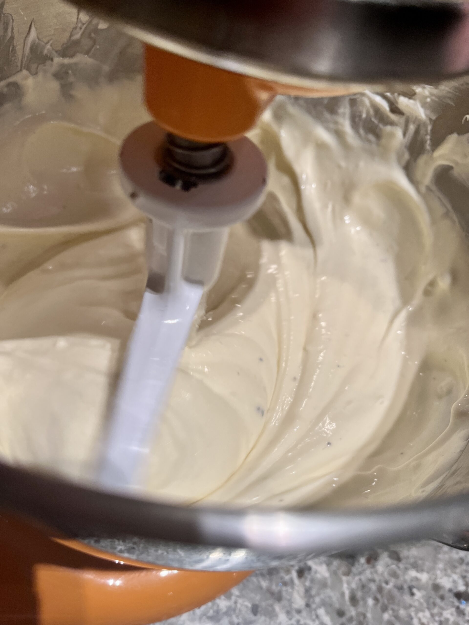 use mixer to combine cheesecake ingredients