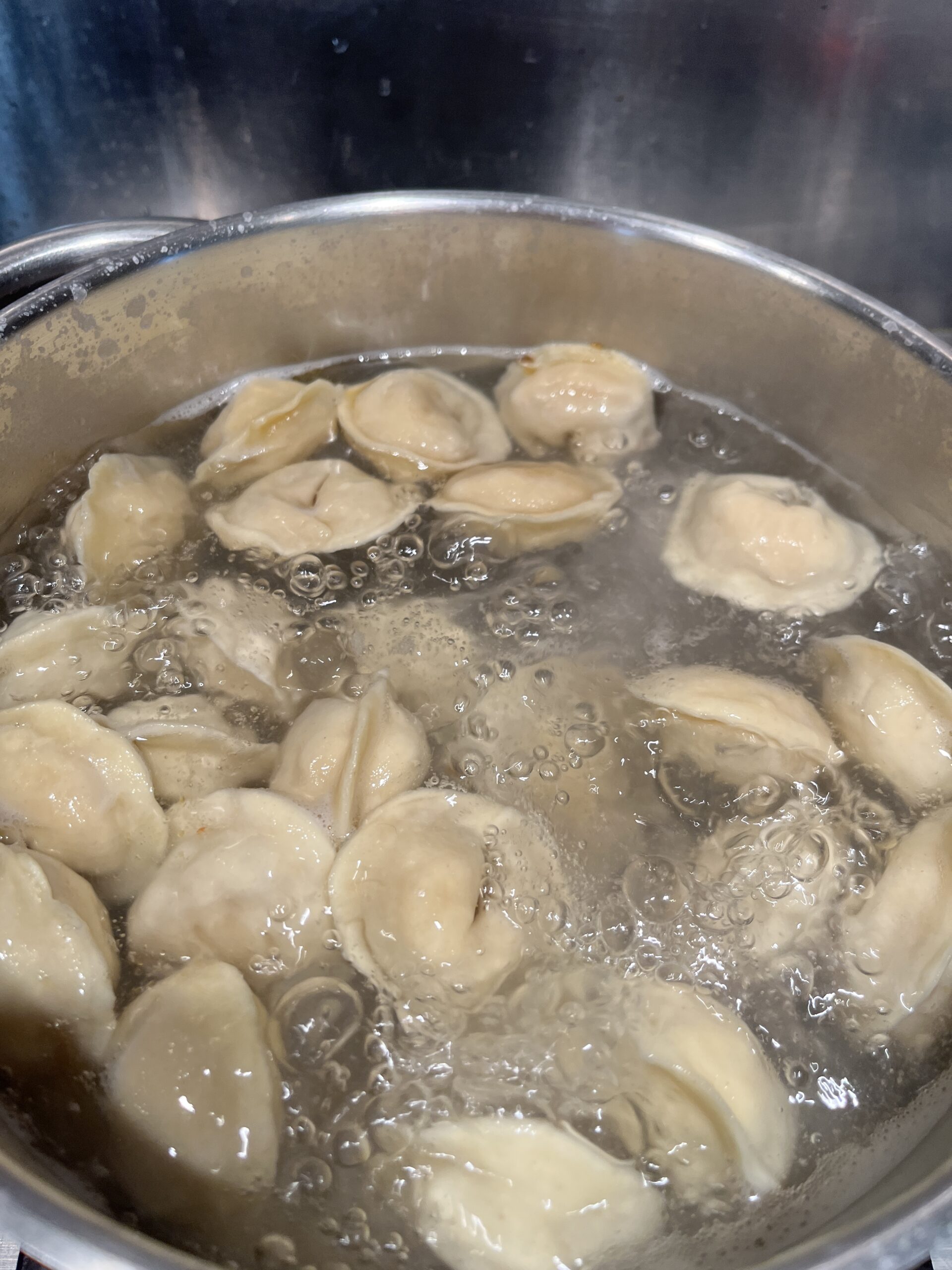 cook tortellini in a slightly salted water