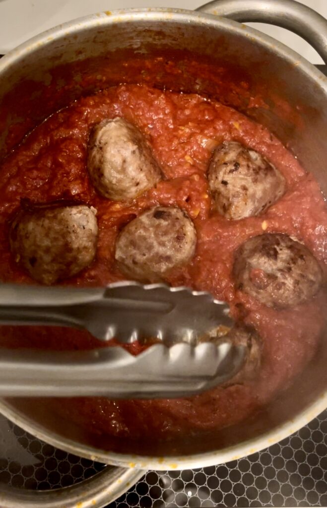 add meatballs to tomato sauce